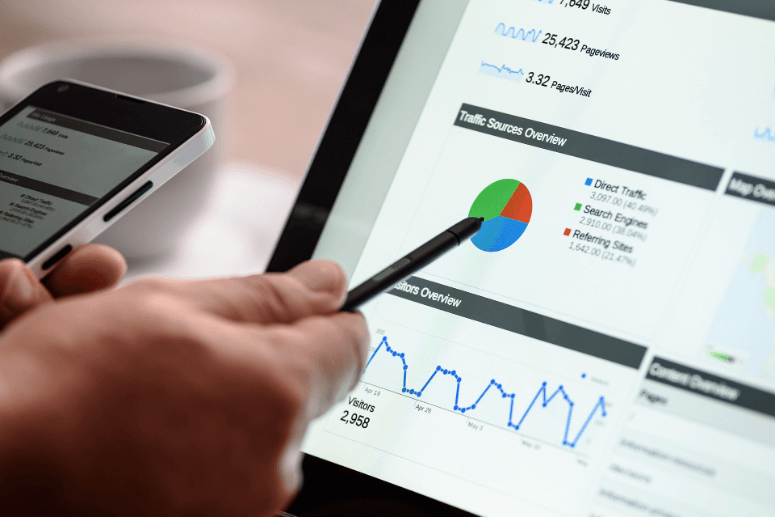 A marketing agency employee studies analytics from a client’s marketing campaign and assesses the performance of current content.