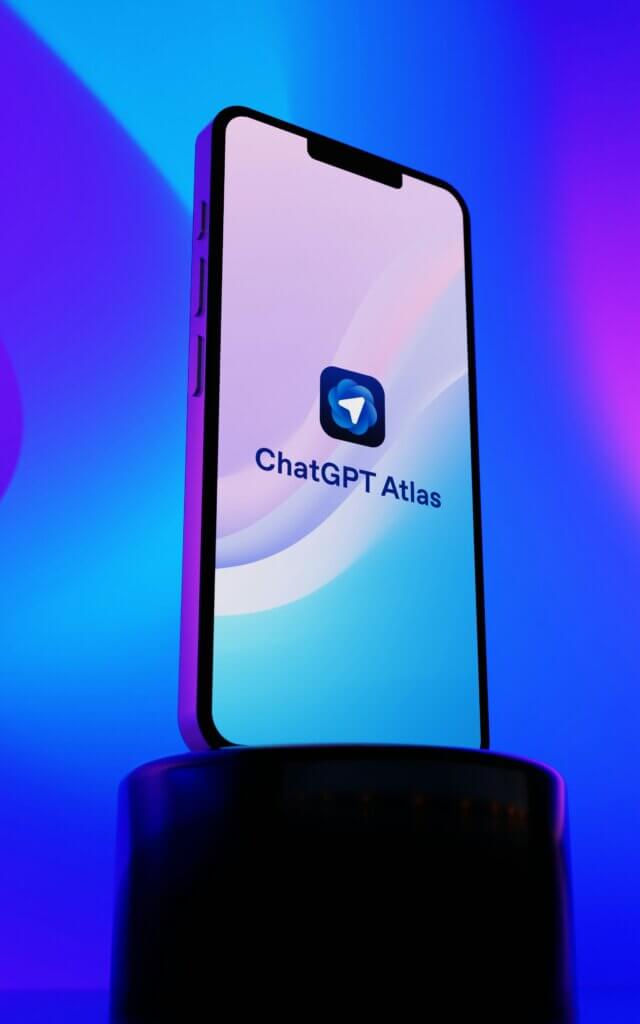 A mobile phone screen displaying the ChatGPT Atlas app icon, illustrating the use of ChatGPT Atlas for B2B growth.