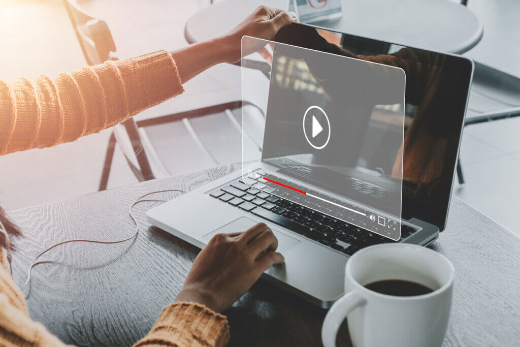 Woman watching online movie or TV series on laptop computer